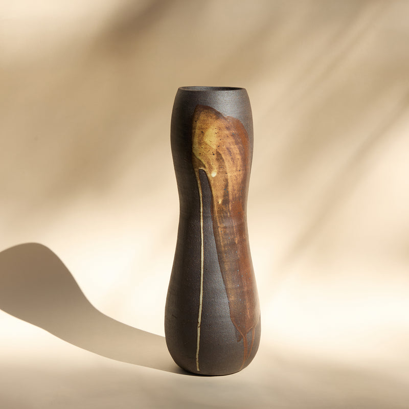 raw clay vase with marks